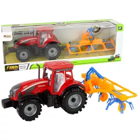 Piros traktor gereblyével, súrlódóhajtással