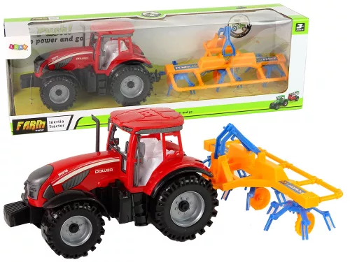 Piros traktor gereblyével, súrlódóhajtással