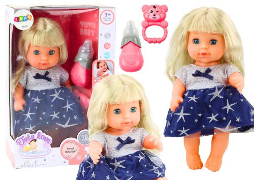 Sötétkék ruhás baba pisiléssel csörgő hangokat hallatva