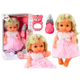   Világos rózsaszín ruhás baba pisilős üveggel és csörgő hangokkal