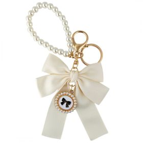 Krémszínű masnis kulcstartó gyöngyökkel BRL362K